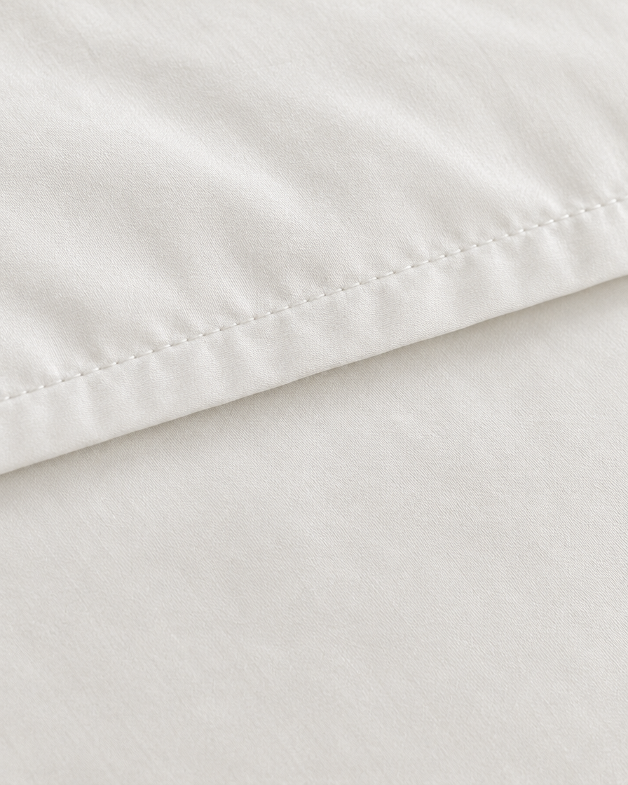 Close-up of stitched hem of the duvet cover in Milky White Silky Cotton