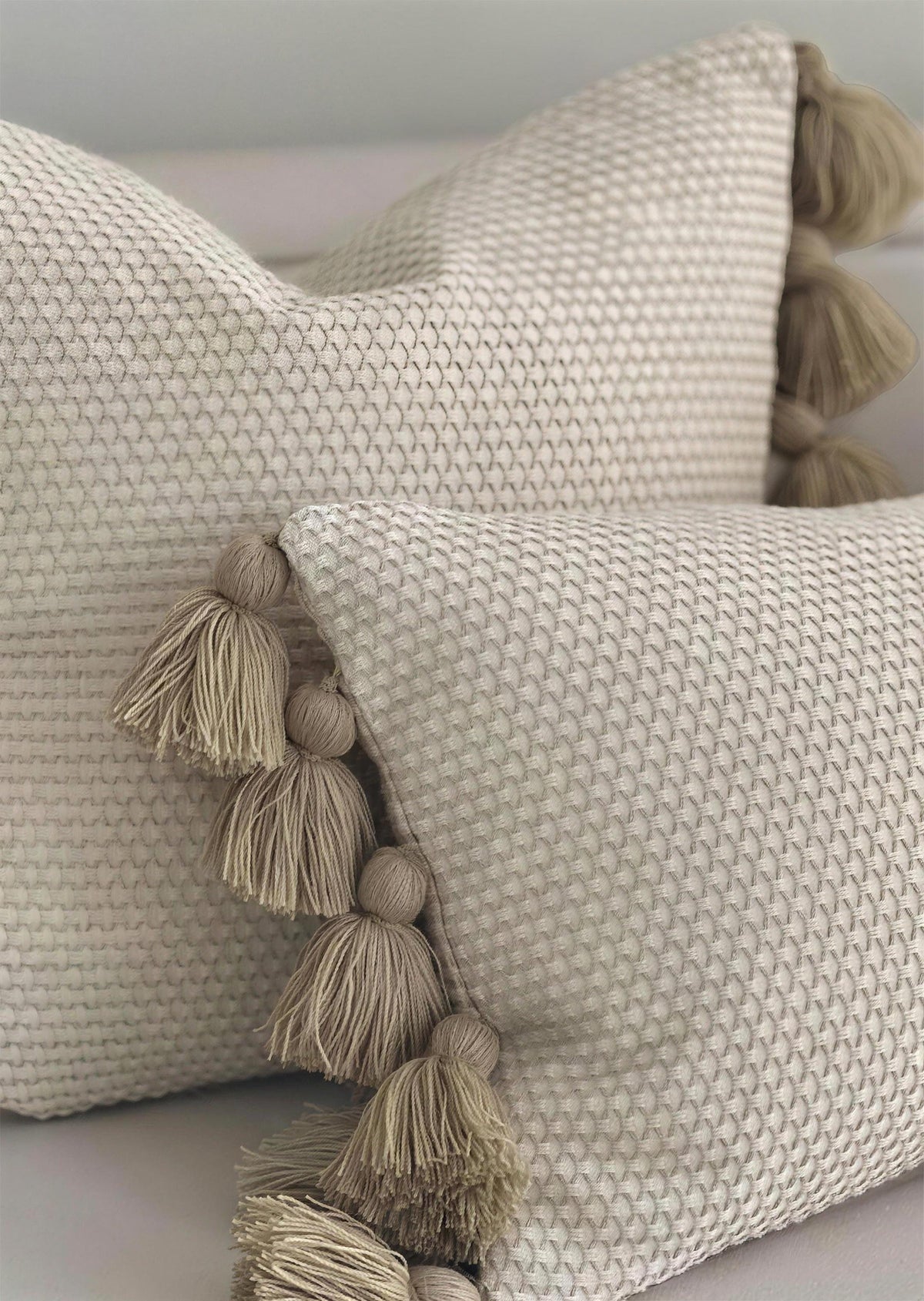 Oat jacquard & tassel cushion covers, styled at home