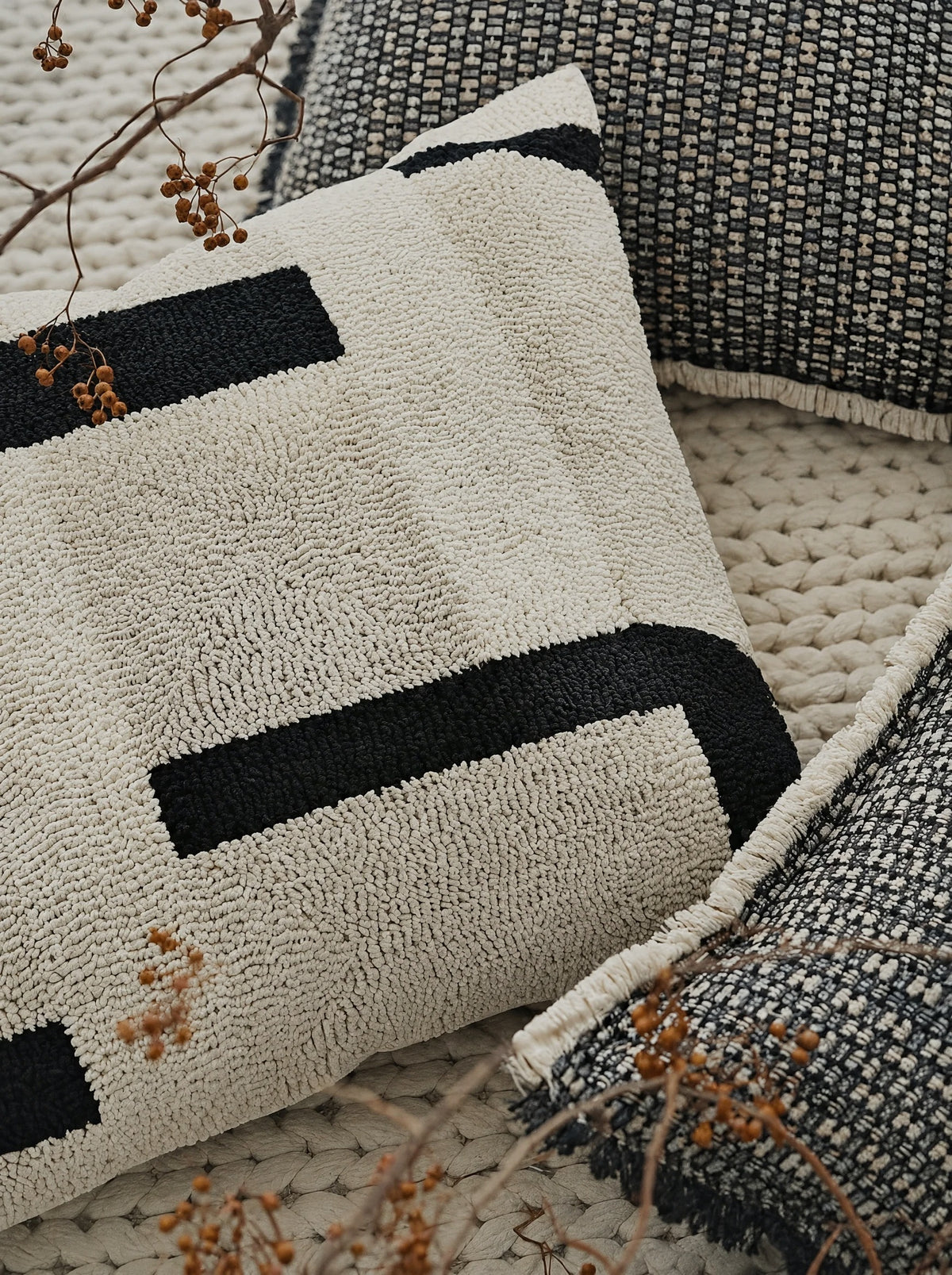 Ivory & Black loop-pile embroidery cushion covers, styled at home