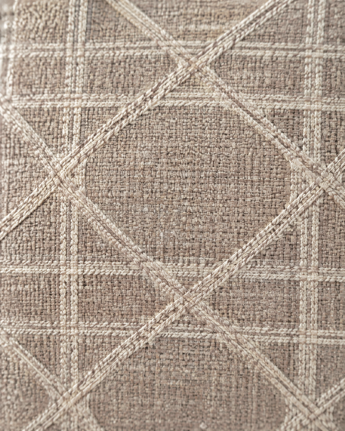 Macro close-up of the blush taupe lattice, a woven ivory cane lattice on slubby blush-taupe linen