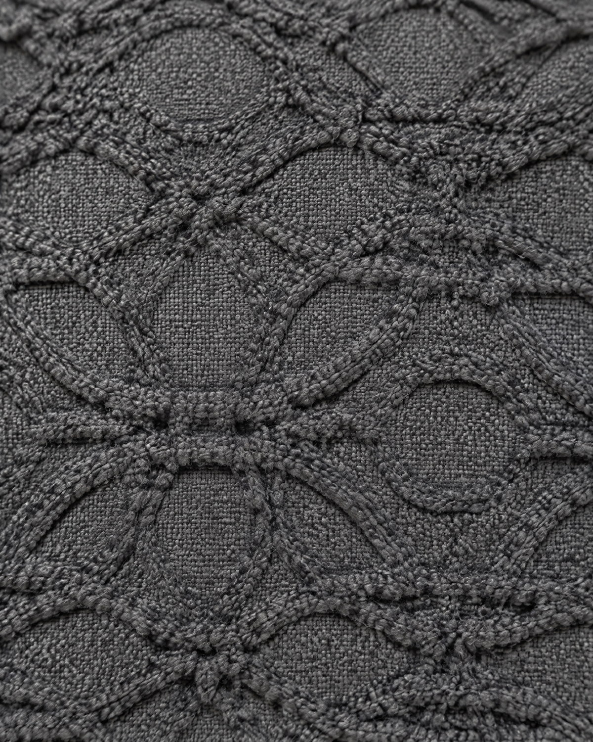 Close-up of charcoal lattice jacquard texture