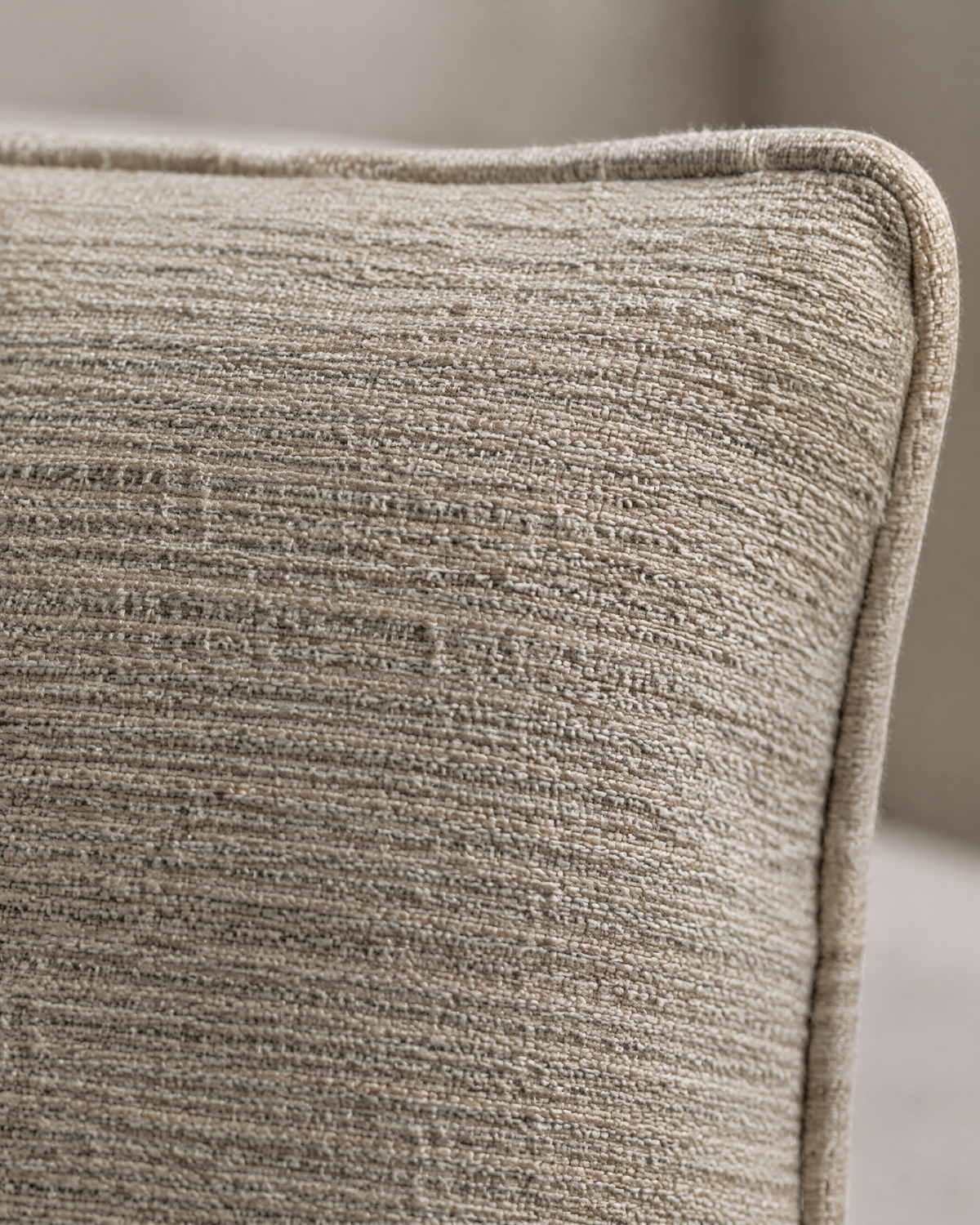 Macro close-up of fine combed ribs in taupe hemp-cotton jacquard beside its self-piped edge