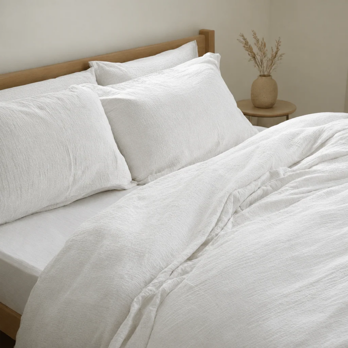 Off White cloud cotton duvet cover and pillowcases in clean soft white, close view of the crinkled weave