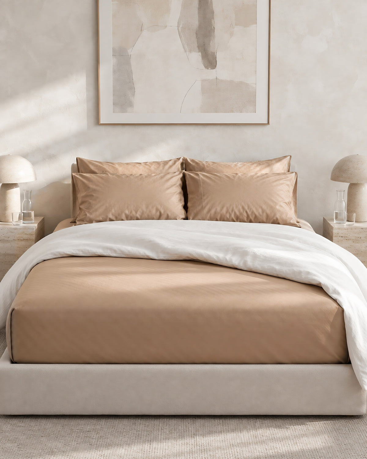 Light Beige silky cotton sateen fitted sheet with matching pillowcases on an upholstered bed
