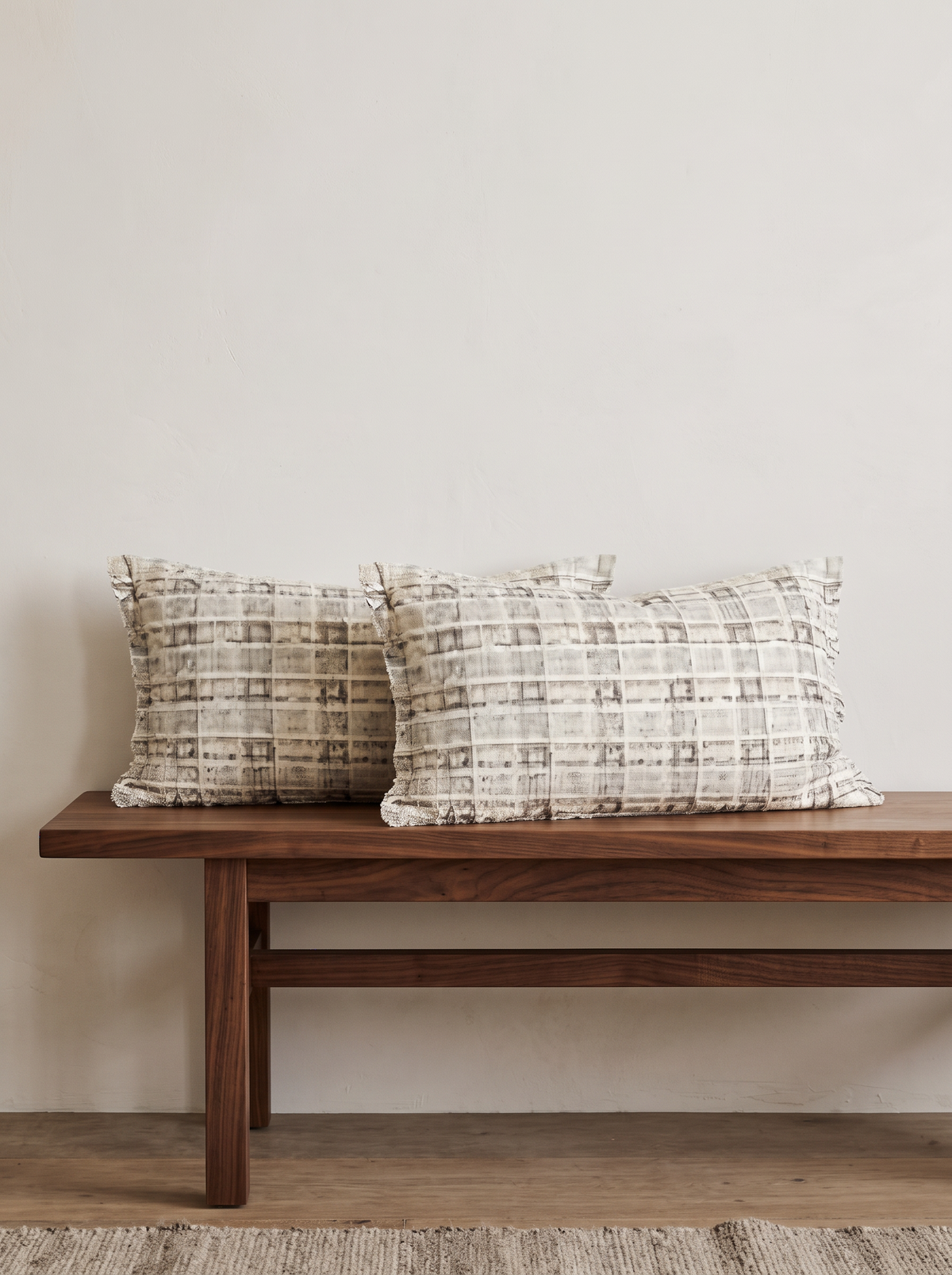 Rose & Ivory Tweed and Bouclé Cushion Covers in Ivory Tweed Lumbar, styled at home on a walnut bench