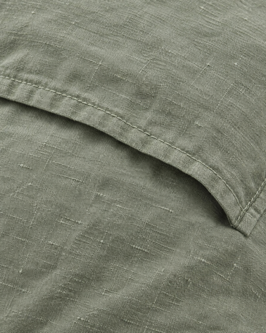 Close-up of stitched envelope opening hem of the pillowcase in Sage Linen