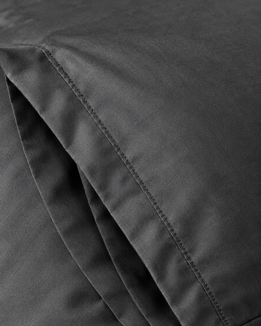 Close-up of stitched envelope opening hem of the pillowcase in Charcoal Grey Silky Cotton