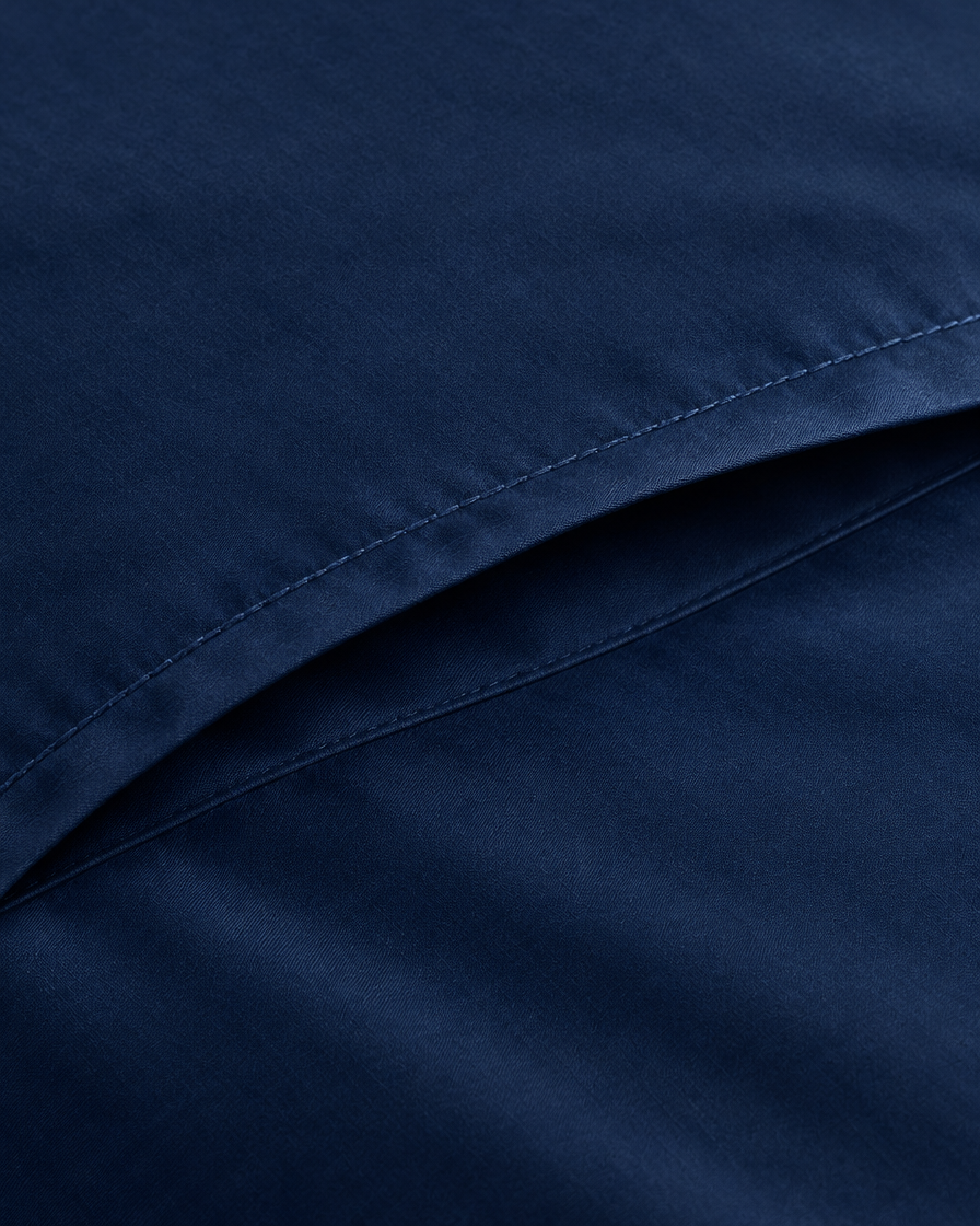Close-up of stitched envelope opening hem of the pillowcase in Marine Blue Silky Cotton
