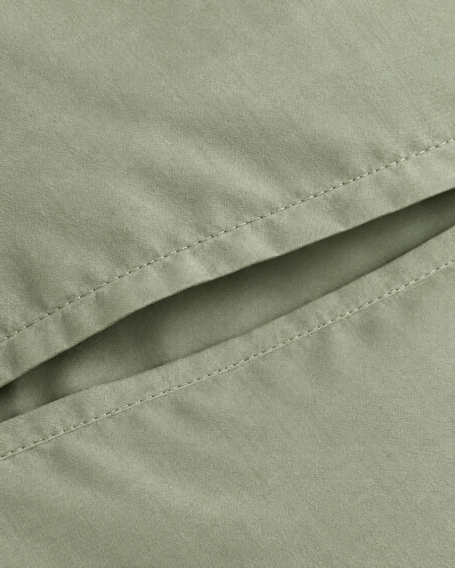 Close-up of stitched envelope opening hem of the pillowcase in Mint Green Silky Cotton