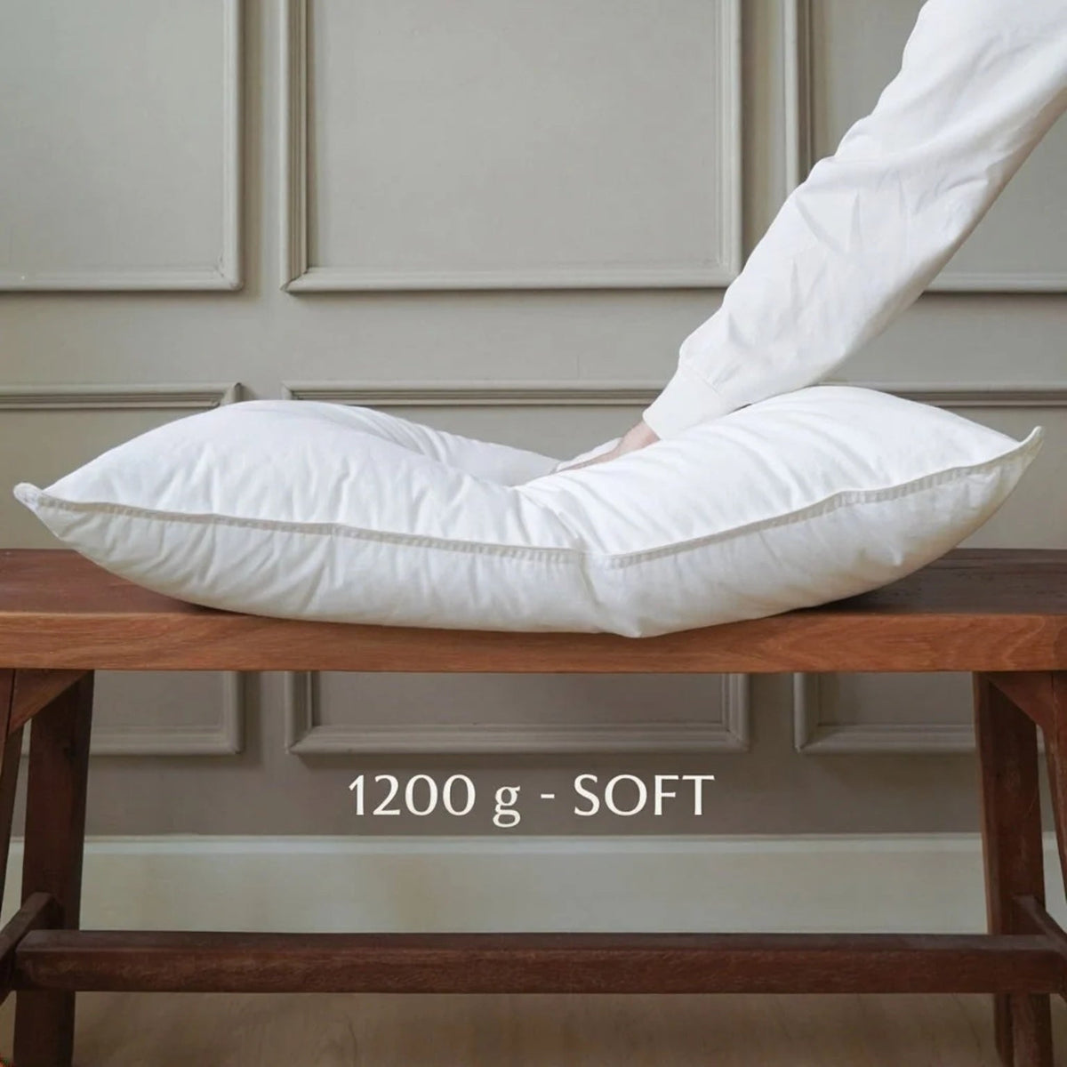 Microgel pillow insert in the 1200 g soft fill, pressed by hand to show the loft.