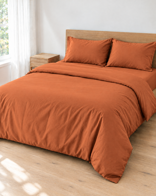 Terracotta Plain Cotton percale bedding set made up on a double bed