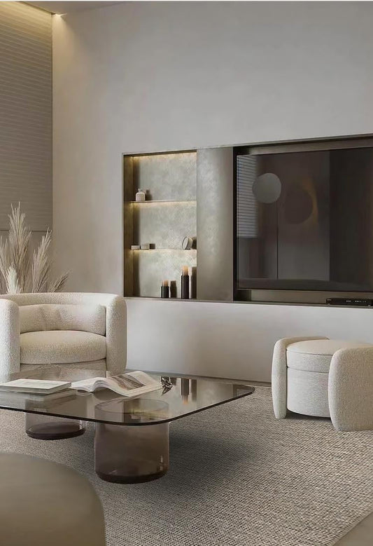 Sand wool and jute rug under a glass coffee table in a living room