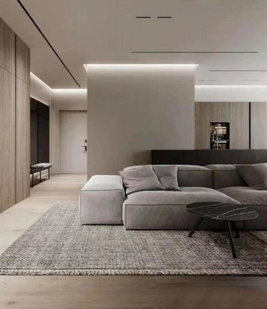 Heathered wool loop-pile rug under a grey corner sofa in a living room