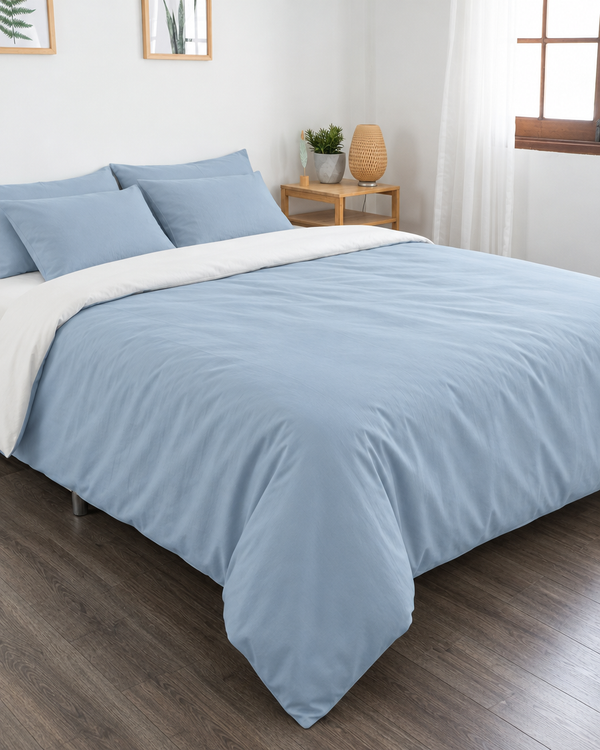 Baby Blue duvet cover with off white reverse, off white fitted sheet and baby blue pillowcases in Plain Cotton