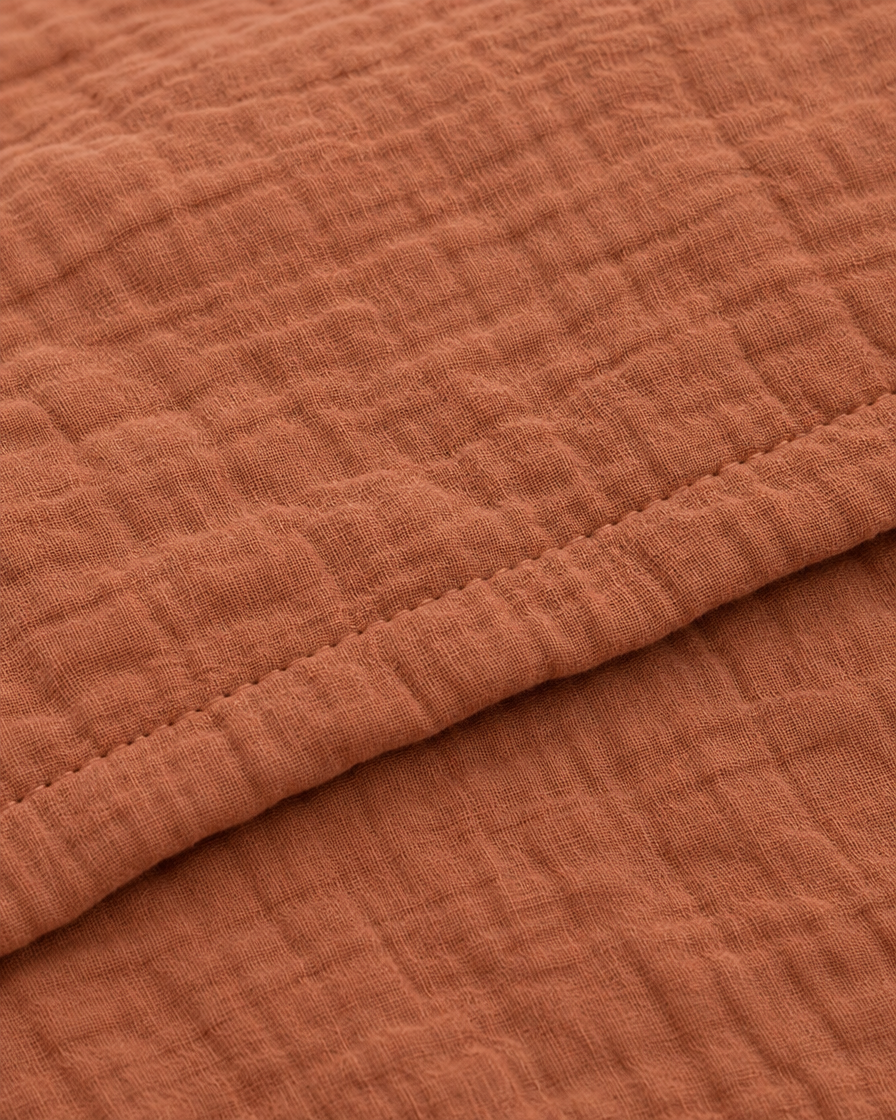 Close-up of stitched hem of the duvet cover in Copper Cloud Cotton
