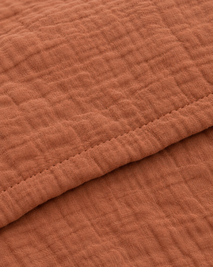 Close-up of stitched hem of the duvet cover in Copper Cloud Cotton