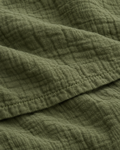 Close-up of stitched hem of the duvet cover in Juniper Green Cloud Cotton