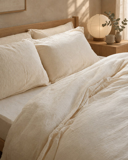 Off-white cloud cotton duvet and pillows, styled in a serene Japandi bedroom