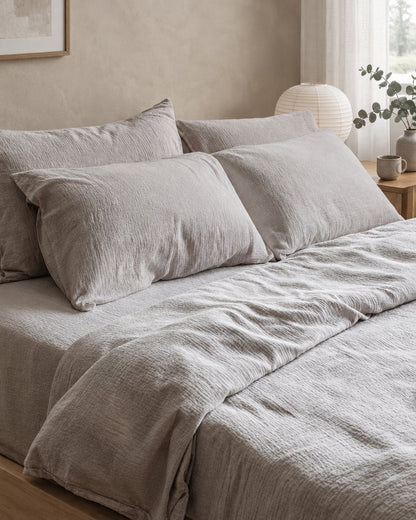 Warm grey cloud cotton duvet and pillows, styled in a serene Japandi bedroom