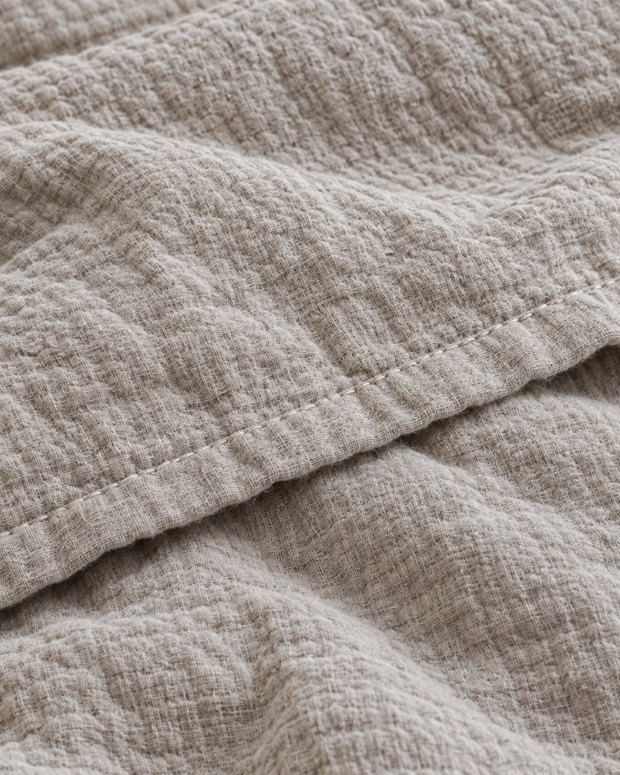 Close-up of stitched hem of the duvet cover in Oat Milk Cloud Cotton