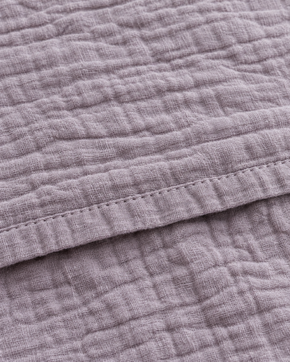 Close-up of stitched hem of the duvet cover in Taro Cloud Cotton