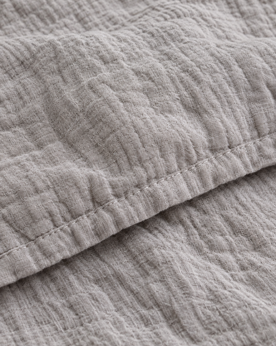 Close-up of stitched hem of the duvet cover in Warm Grey Cloud Cotton