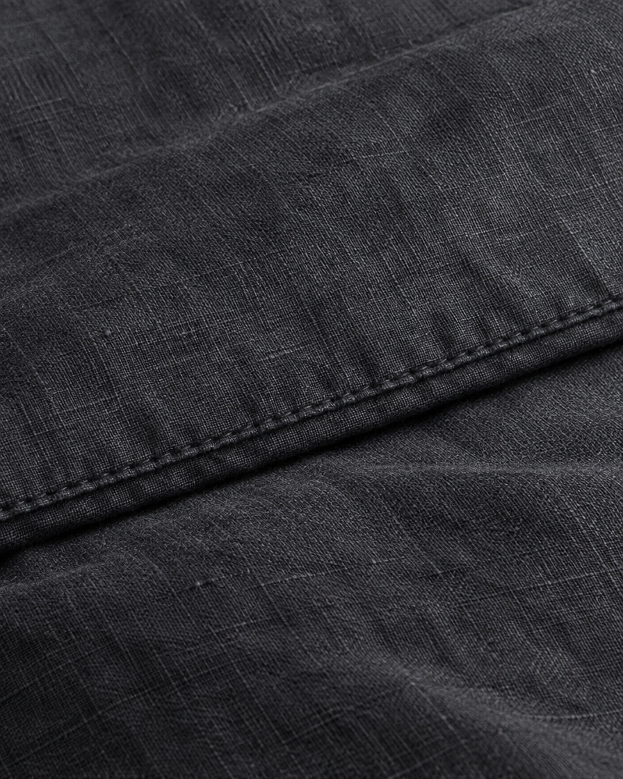 Close-up of stitched hem of the duvet cover in Charcoal Linen