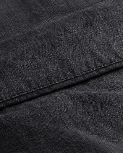 Close-up of stitched hem of the duvet cover in Charcoal Linen