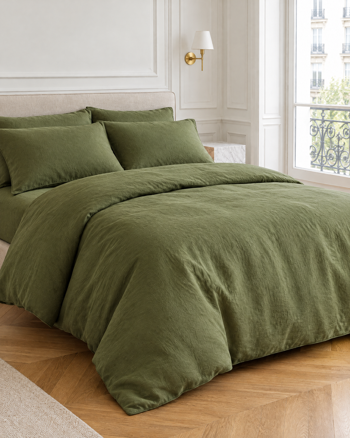 Moss Green linen bedding set on a made bed in a bright bedroom