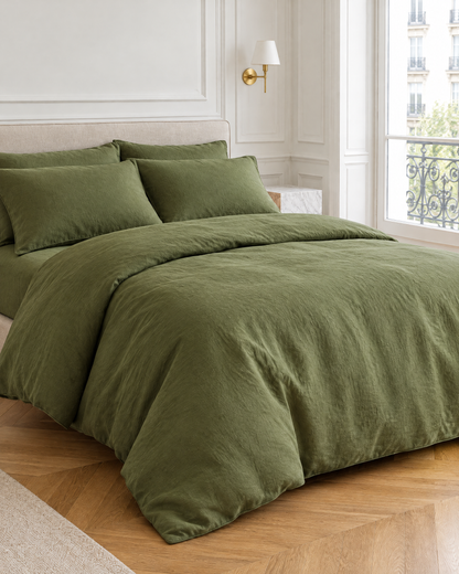 Moss Green linen bedding set on a made bed in a bright bedroom
