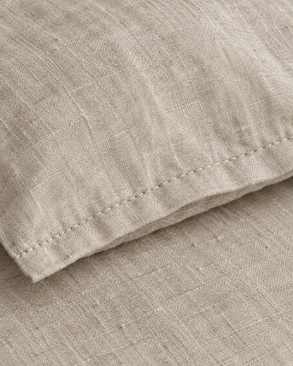 Close-up of stitched hem of the duvet cover in Natural Linen