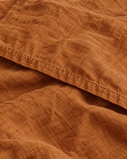 Close-up of stitched hem of the duvet cover in Terracotta Linen