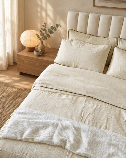 Cream piped cloud cotton bedding, styled in a serene Japandi bedroom