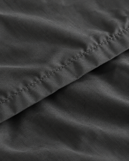 Close-up of stitched hem of the duvet cover in Charcoal Grey Silky Cotton