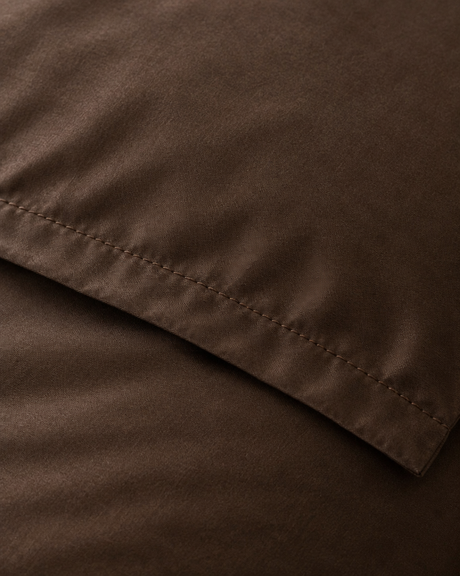 Close-up of stitched hem of the duvet cover in Chocolate Silky Cotton