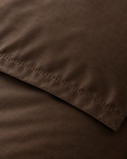 Close-up of stitched hem of the duvet cover in Chocolate Silky Cotton