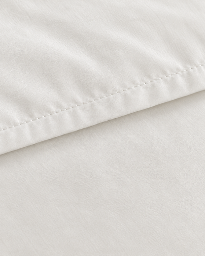 Close-up of stitched hem of the duvet cover in Milky White Silky Cotton