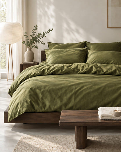 Juniper Green silky cotton bedding set in a calm Japandi bedroom on a low dark-oak bed