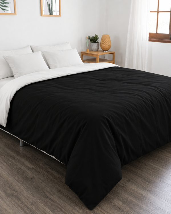 Black duvet cover with off white reverse, off white fitted sheet and off white pillowcases in Plain Cotton