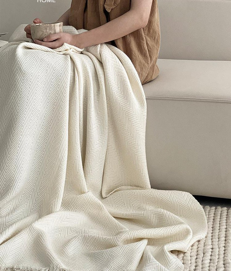 Ivory Herringbone Wool Blend throw, styled at home