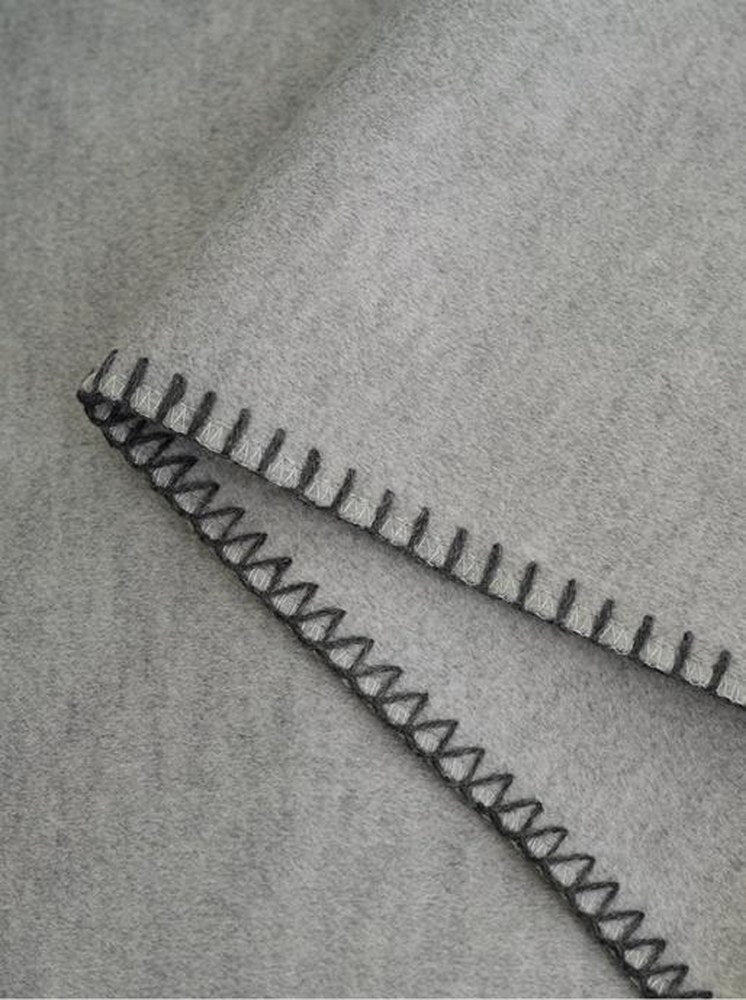Blanket-Stitch Soft-Touch throw, styled at home
