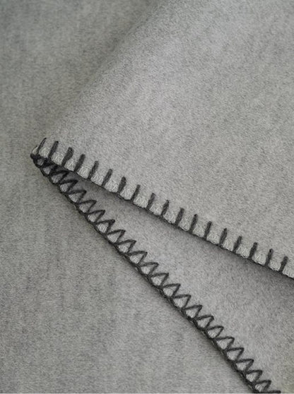 Blanket-Stitch Soft-Touch throw, styled at home