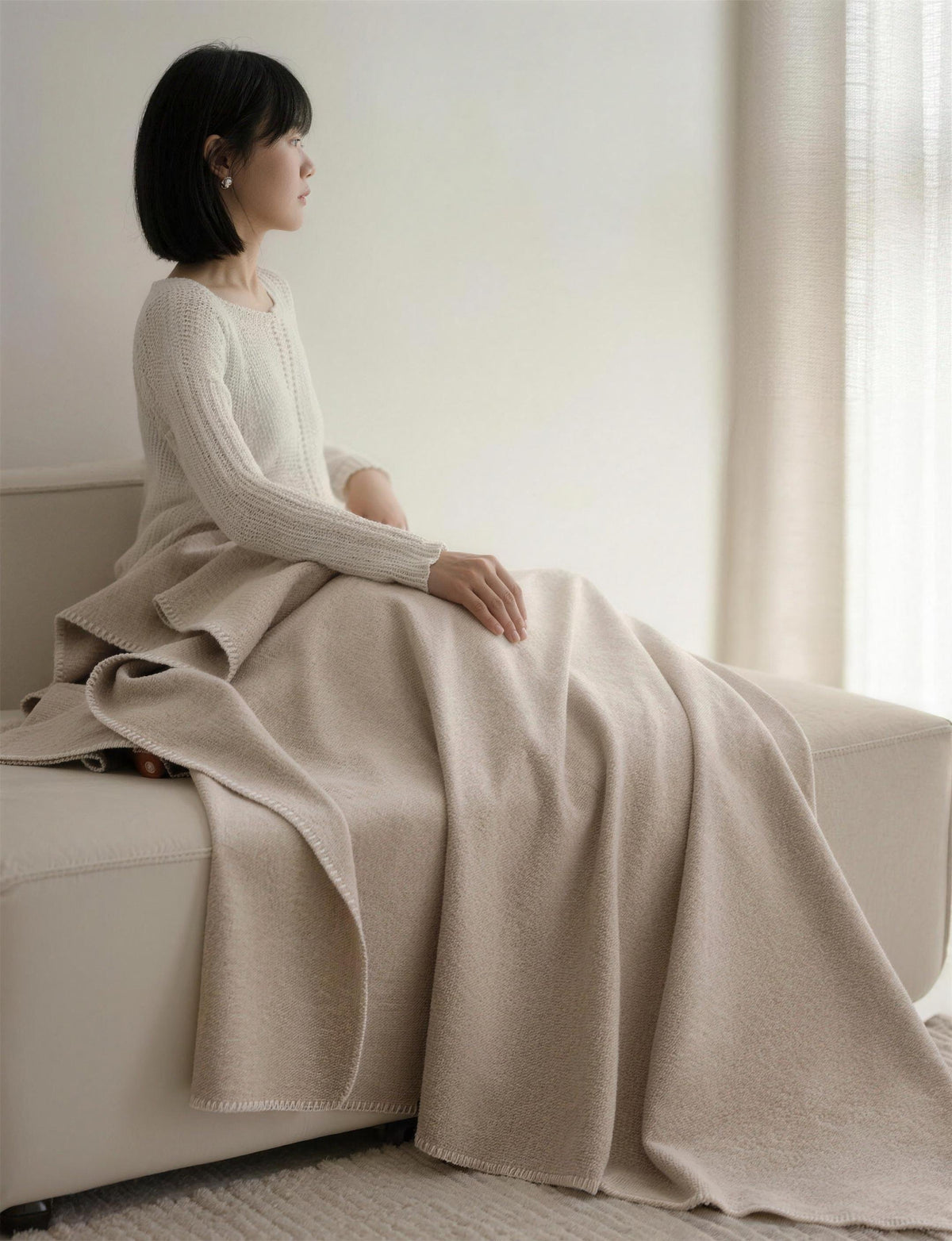 Blanket-Stitch Soft-Touch throw, styled at home