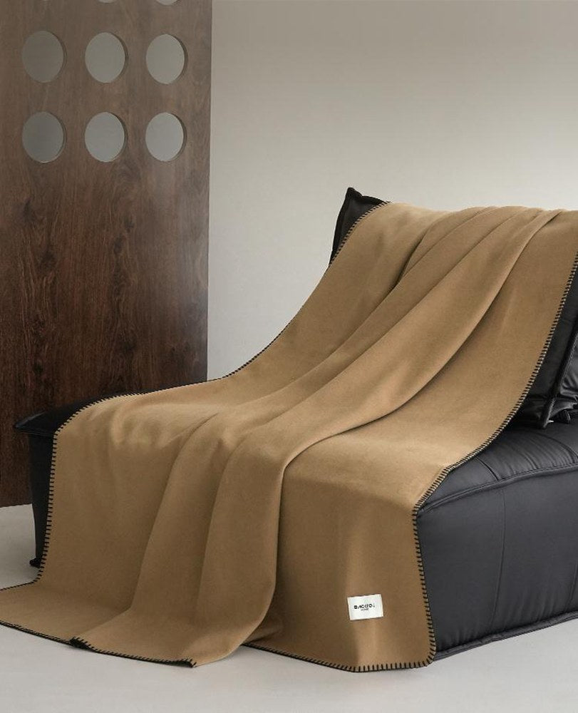 Blanket-Stitch Soft-Touch throw, styled at home