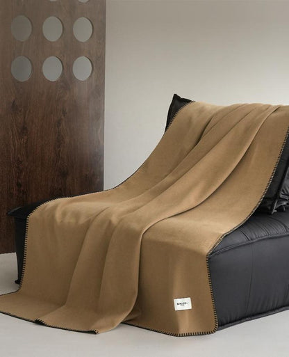 Blanket-Stitch Soft-Touch throw, styled at home