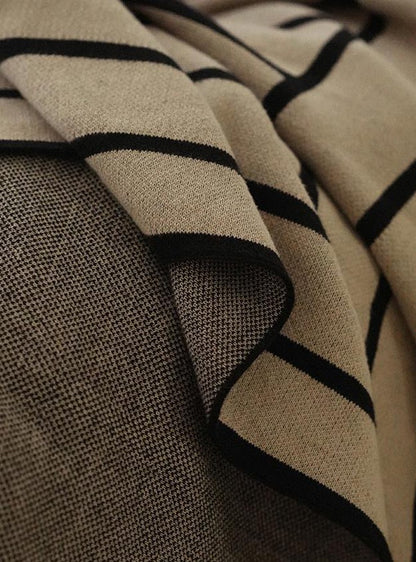 Close-up of the Striped Combed Cotton Knit Throw showing taupe and black stripes and the knit texture