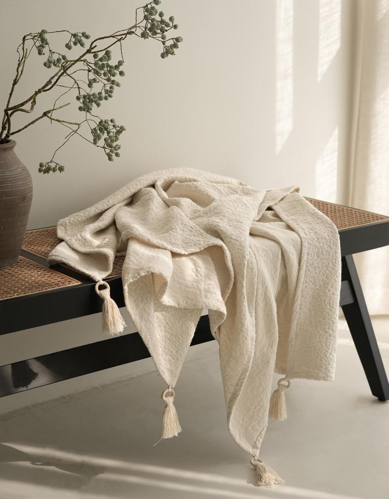 Ivory Tasselled Cotton throw, styled at home