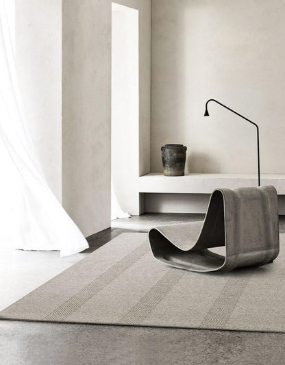 Striped Border Woven rug, styled at home