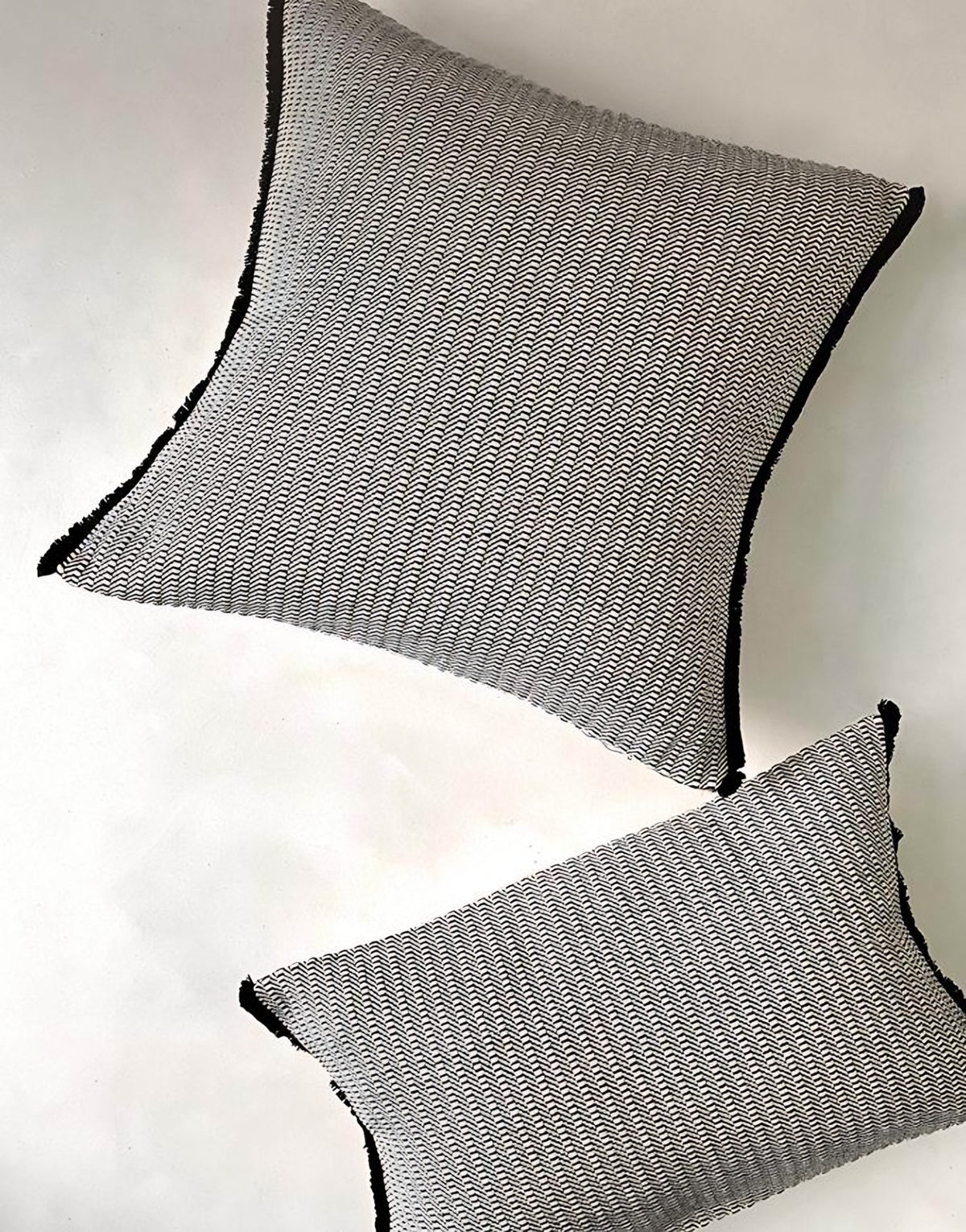 Grey & Black jacquard & tassel cushion covers, styled at home