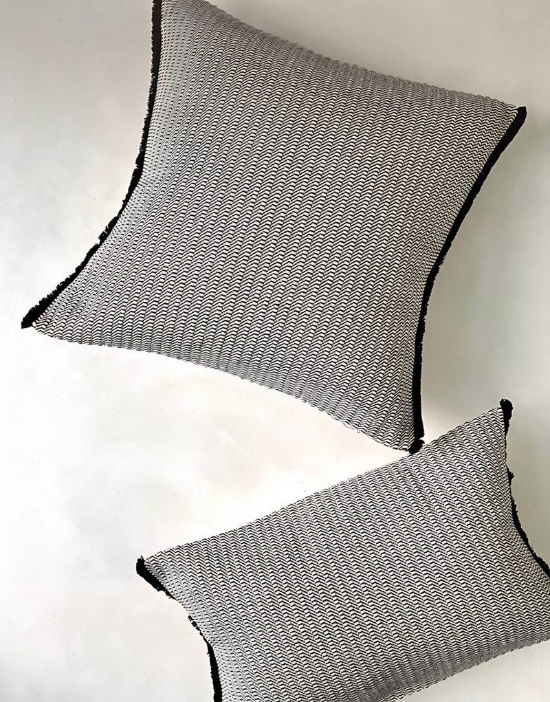 Grey & Black jacquard & tassel cushion covers, styled at home
